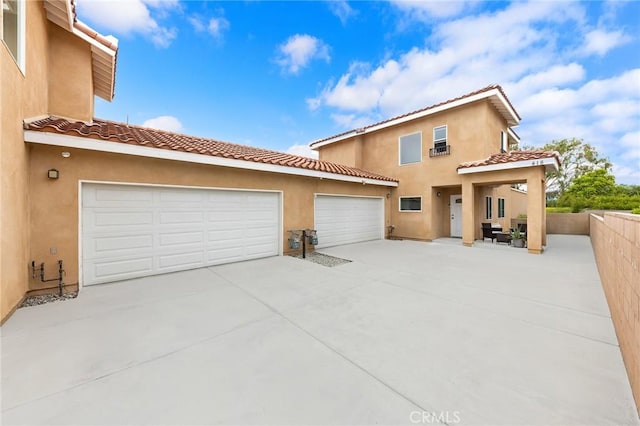 418 N Dalton Ave, Azusa, CA 91702 - view of front facade featuring driveway, stucco siding, a tiled roof, and a garage