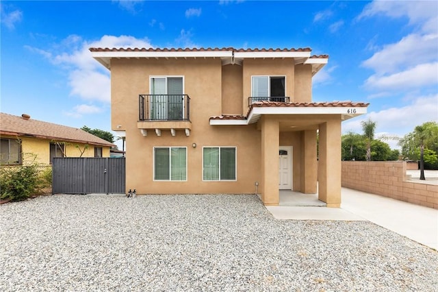 418 N Dalton Ave, Azusa, CA 91702 - rear view of property with a balcony, a gate, stucco siding, and a tile roof
