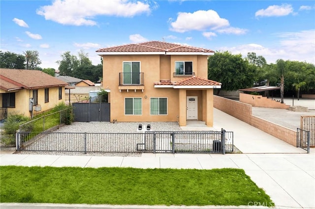 418 N Dalton Ave, Azusa, CA 91702 - back of property with a gate, a tiled roof, stucco siding, concrete driveway, and a balcony
