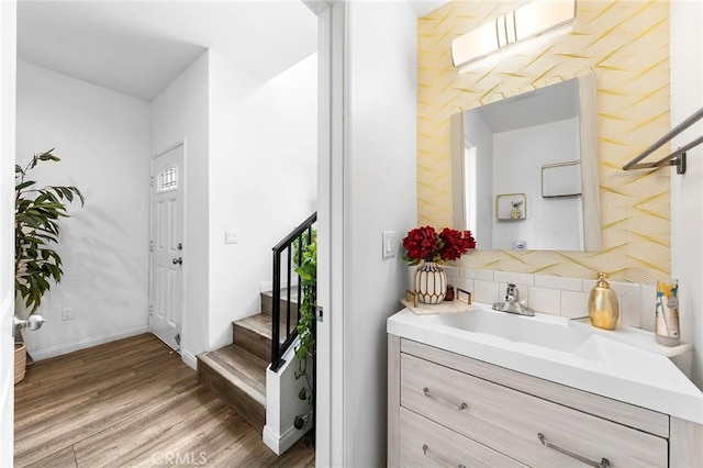 418 N Dalton Ave, Azusa, CA 91702 - bathroom with backsplash, vanity, and wood finished floors