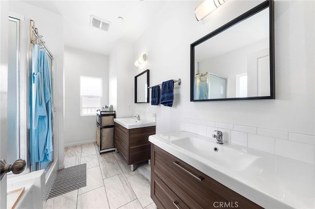 418 N Dalton Ave, Azusa, CA 91702 - full bathroom featuring a shower, two vanities, marble look tiles, and a bath