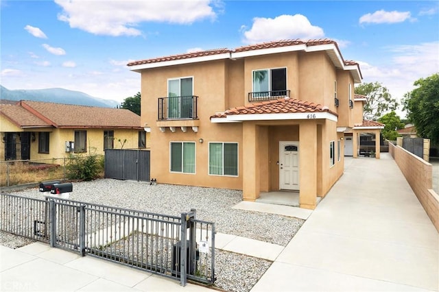 418 N Dalton Ave, Azusa, CA 91702 - view of front of house featuring a tiled roof, a gate, and stucco siding