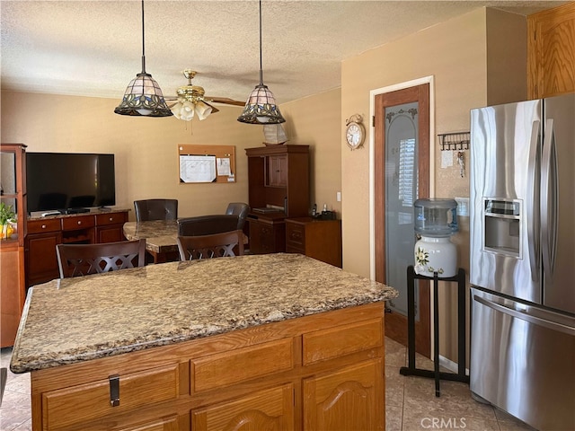 4474 Juanita Ct, Chino, CA 91710 - kitchen with stainless steel refrigerator with ice dispenser, ceiling fan, light tile patterned floors, a textured ceiling, and hanging light fixtures