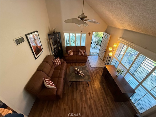 4474 Juanita Ct, Chino, CA 91710 - living room with wood finished floors, ceiling fan, high vaulted ceiling, and a textured ceiling
