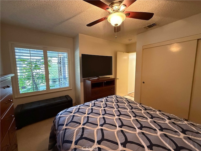4474 Juanita Ct, Chino, CA 91710 - bedroom with a textured ceiling, a closet, ceiling fan, and carpet floors