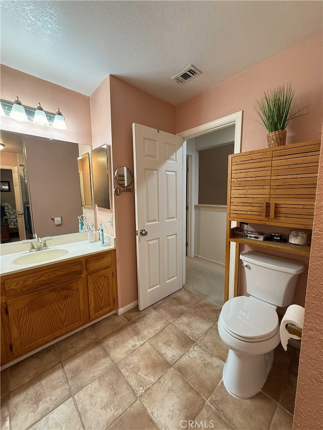 4474 Juanita Ct, Chino, CA 91710 - bathroom featuring vanity and a textured ceiling