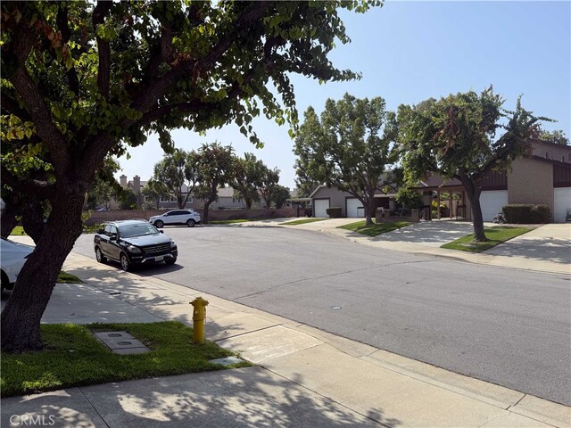 4474 Juanita Ct, Chino, CA 91710 - view of asphalt street featuring sidewalks, curbs, and a residential view