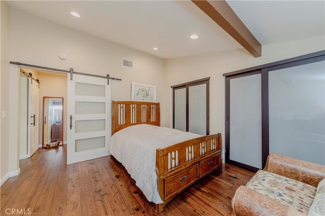 5276 Willow Wood Rd, Rolling Hills Estates, CA 90274 - bedroom featuring hardwood / wood-style flooring, a barn door, recessed lighting, two closets, and beamed ceiling