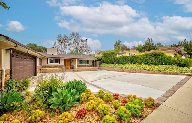 5276 Willow Wood Rd, Rolling Hills Estates, CA 90274 - ranch-style house featuring stone siding, an attached garage, stucco siding, a chimney, and driveway