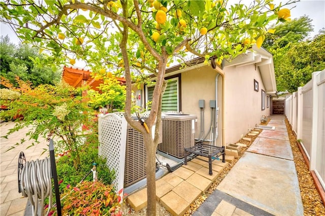 5276 Willow Wood Rd, Rolling Hills Estates, CA 90274 - view of side of property featuring stucco siding, a fenced backyard, and a patio area