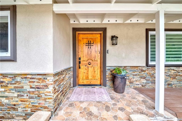 5276 Willow Wood Rd, Rolling Hills Estates, CA 90274 - entrance to property featuring stucco siding, stone siding, and covered porch