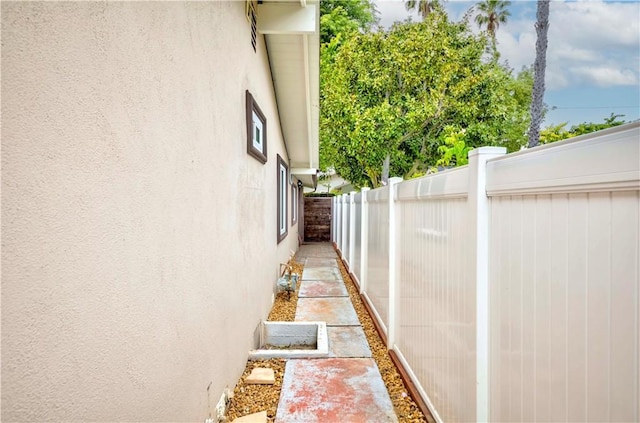 5276 Willow Wood Rd, Rolling Hills Estates, CA 90274 - view of side of home featuring stucco siding
