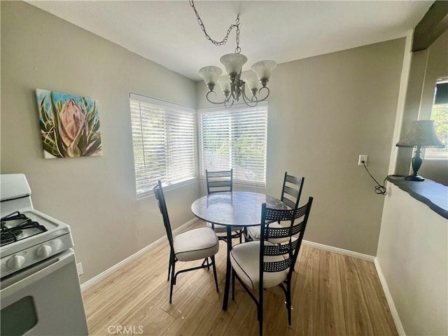 2226 Evans Dr, Arrowbear, CA 92382 - dining area featuring a chandelier, light wood finished floors, and plenty of natural light