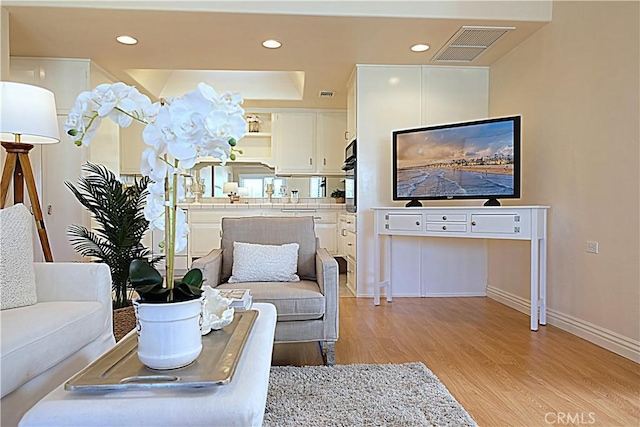 1681 Tam Oshanter Rd Unit 10C M12, Seal Beach, CA 90740 - living area featuring light wood-style flooring and recessed lighting