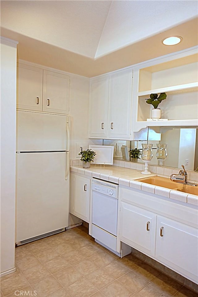 1681 Tam Oshanter Rd Unit 10C M12, Seal Beach, CA 90740 - kitchen featuring white appliances, tile countertops, open shelves, white cabinets, and vaulted ceiling