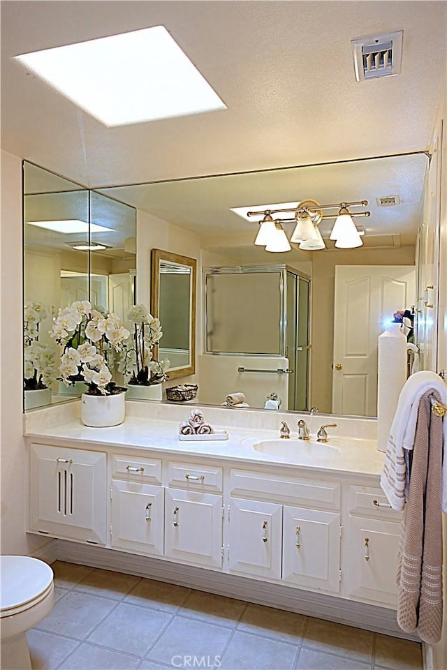 1681 Tam Oshanter Rd Unit 10C M12, Seal Beach, CA 90740 - full bath featuring double vanity, tile patterned floors, and a shower stall