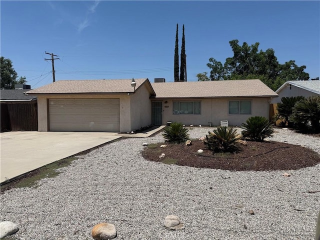 7774 Drummond Ave, Highland, CA 92346 - ranch-style house featuring concrete driveway, a garage, and stucco siding