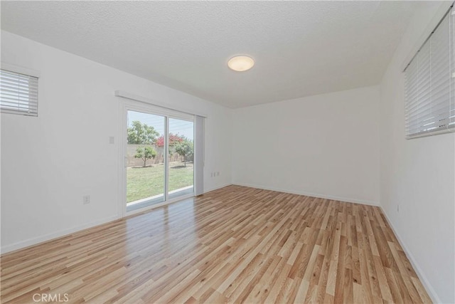 2406 Descanso Way, Torrance, CA 90504 - empty room with light wood-type flooring and a textured ceiling