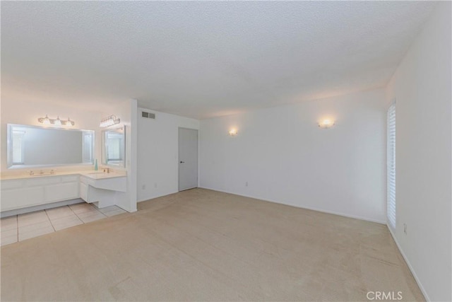 2406 Descanso Way, Torrance, CA 90504 - spare room with light carpet, a textured ceiling, and light tile patterned flooring