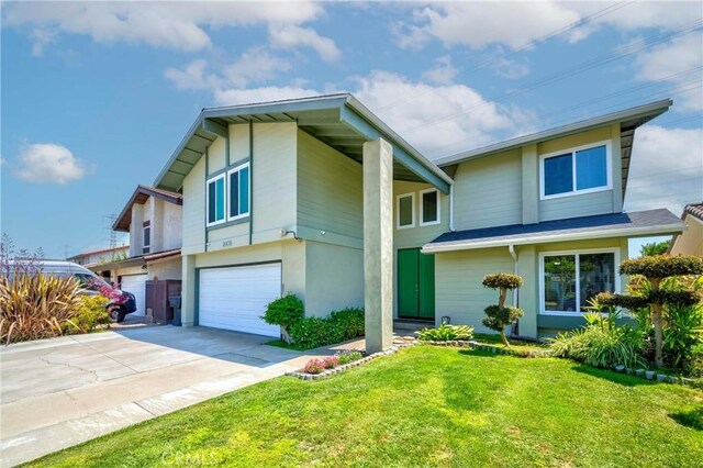 2406 Descanso Way, Torrance, CA 90504 - view of front of home featuring stucco siding, an attached garage, a front yard, and driveway