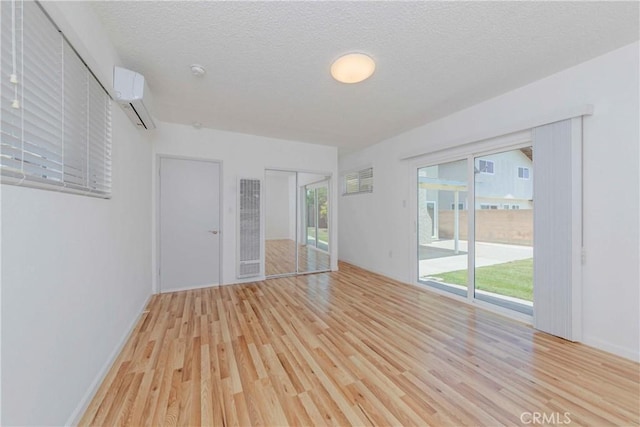 2406 Descanso Way, Torrance, CA 90504 - unfurnished room featuring a heating unit, wood finished floors, and a textured ceiling