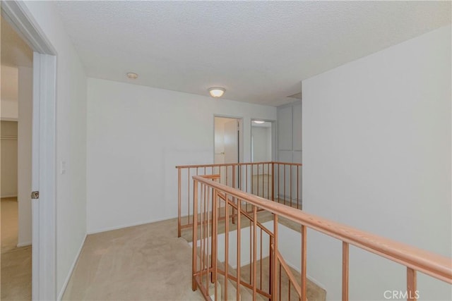 2406 Descanso Way, Torrance, CA 90504 - hall featuring an upstairs landing, carpet floors, and a textured ceiling
