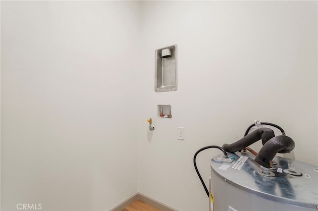 1241 W 22nd St, Los Angeles, CA 90007 - washroom with washer hookup, water heater, and light wood-style floors