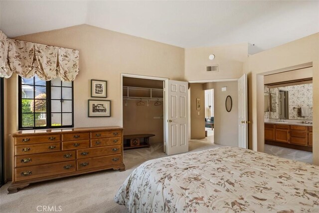27815 Sheffield, Mission Viejo, CA 92692 - bedroom with light carpet, vaulted ceiling, a closet, a spacious closet, and ensuite bath