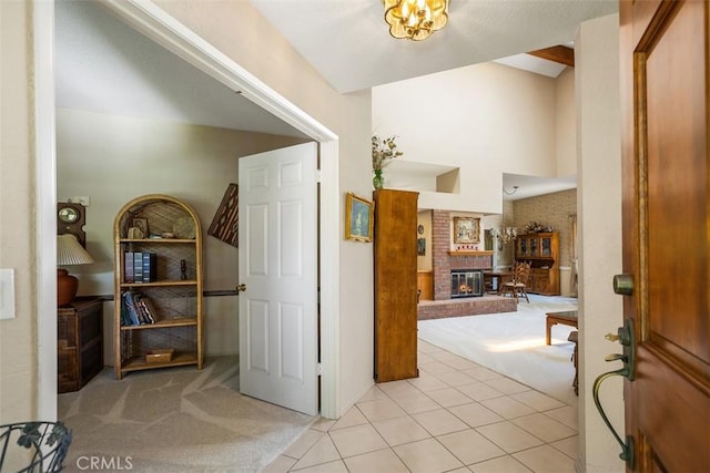 27815 Sheffield, Mission Viejo, CA 92692 - foyer entrance featuring light carpet, light tile patterned floors, and a fireplace