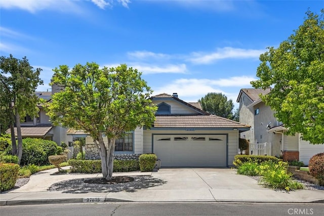 27815 Sheffield, Mission Viejo, CA 92692 - view of property hidden behind natural elements with a tiled roof, an attached garage, and driveway