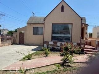 514 W 102nd, Los Angeles, CA 90044 - rear view of house with stucco siding