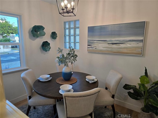 24921 Cypress St, Lomita, CA 90717 - dining area with wood finished floors and a chandelier