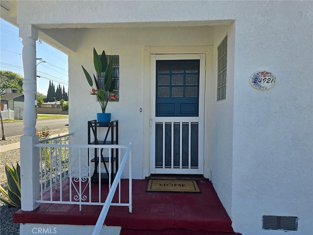 24921 Cypress St, Lomita, CA 90717 - view of exterior entry with covered porch and stucco siding