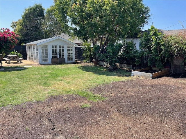 24921 Cypress St, Lomita, CA 90717 - view of yard featuring a vegetable garden and an outbuilding