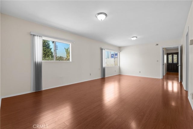 1067 N Wilton Pl, Los Angeles, CA 90038 - empty room with wood finished floors and baseboards