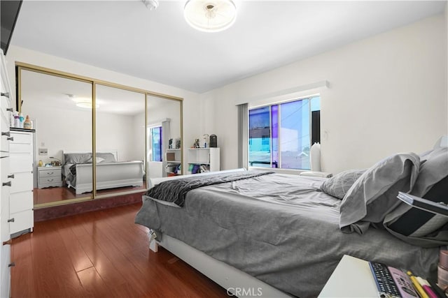 1067 N Wilton Pl, Los Angeles, CA 90038 - bedroom with wood finished floors and a closet