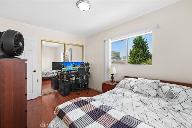 1067 N Wilton Pl, Los Angeles, CA 90038 - bedroom with wood finished floors, a closet, and an office area