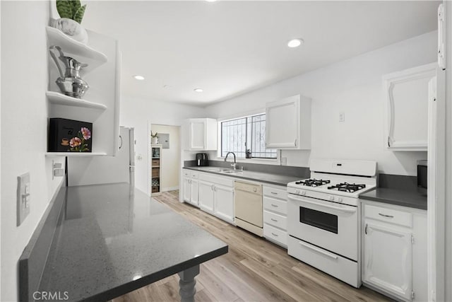1067 N Wilton Pl, Los Angeles, CA 90038 - kitchen featuring open shelves, white appliances, white cabinets, light wood-style flooring, and recessed lighting