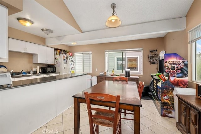 34055 Silver Lantern St, Dana Point, CA 92629 - dining space with light tile patterned flooring and vaulted ceiling
