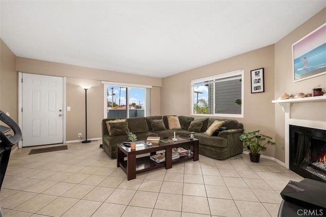 34055 Silver Lantern St, Dana Point, CA 92629 - living room with light tile patterned floors and a lit fireplace