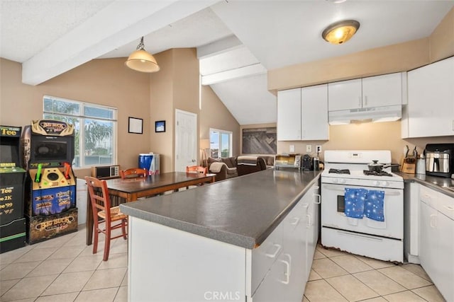 34055 Silver Lantern St, Dana Point, CA 92629 - kitchen with white range with gas stovetop, under cabinet range hood, light tile patterned floors, and dark countertops