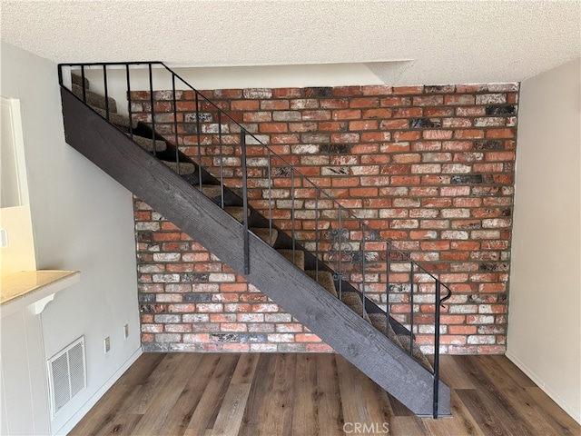 3078 Winfield Ave, La Verne, CA 91750 - stairway featuring a textured ceiling and wood finished floors