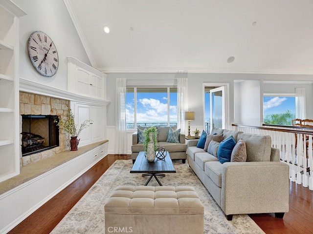 12272 Media Panorama, North Tustin, CA 92705 - living room with wood finished floors, healthy amount of natural light, a fireplace, crown molding, and vaulted ceiling