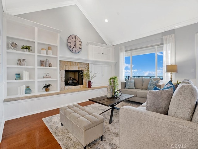 12272 Media Panorama, North Tustin, CA 92705 - living room featuring wood finished floors, a stone fireplace, ornamental molding, high vaulted ceiling, and recessed lighting