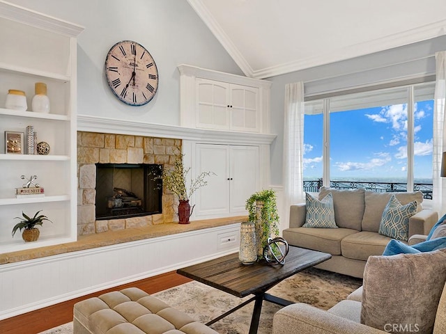 12272 Media Panorama, North Tustin, CA 92705 - living area featuring lofted ceiling, built in features, wood finished floors, crown molding, and a fireplace