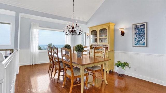 12272 Media Panorama, North Tustin, CA 92705 - dining area with vaulted ceiling, wood finished floors, a chandelier, and wainscoting