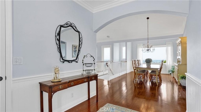 12272 Media Panorama, North Tustin, CA 92705 - dining space with wainscoting, hardwood / wood-style flooring, arched walkways, crown molding, and a chandelier