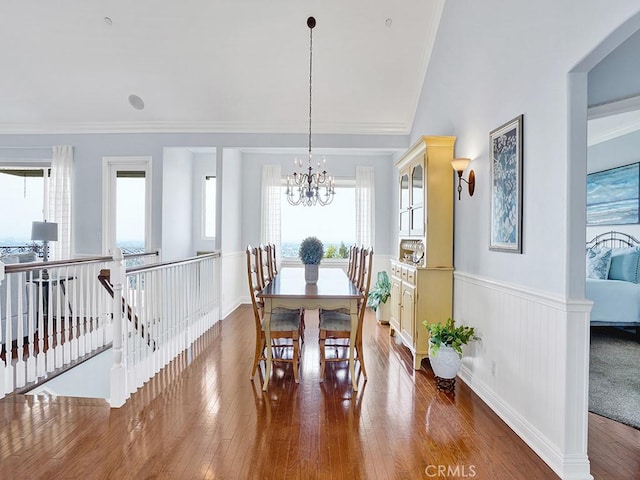 12272 Media Panorama, North Tustin, CA 92705 - dining room with wainscoting, a chandelier, hardwood / wood-style flooring, and ornamental molding