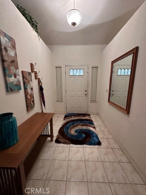 3854 Canvasback Ct, Merced, CA 95340 - entrance foyer with light tile patterned flooring and a textured wall