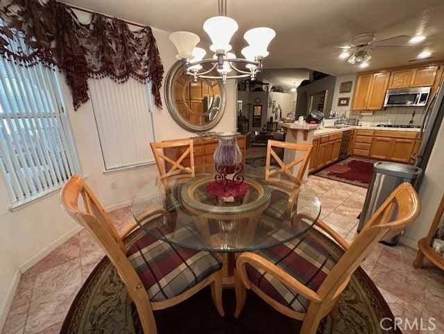 3854 Canvasback Ct, Merced, CA 95340 - dining area with a chandelier and ceiling fan
